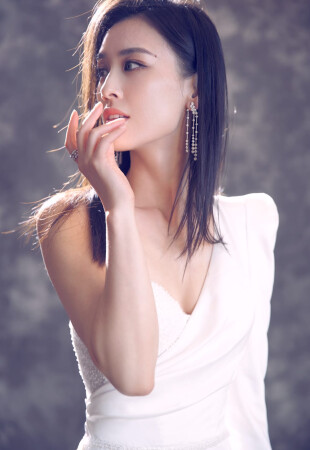 Eva Huang wearing a dress by Ida Torez by Pollardi Fashion Group photo