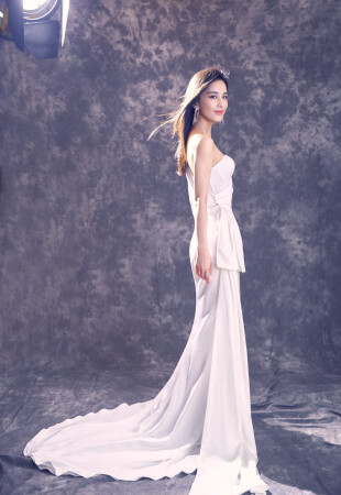 Eva Huang wearing a dress by Ida Torez by Pollardi Fashion Group photo